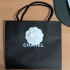 CHANEL Black Bag with White Camellia